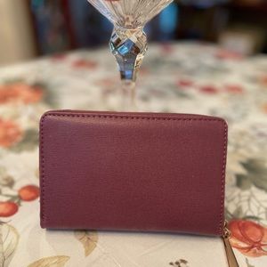 Woman's Mauve wristlet wallet